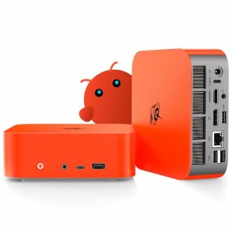 Orange mini PC showing various ports and connectors
